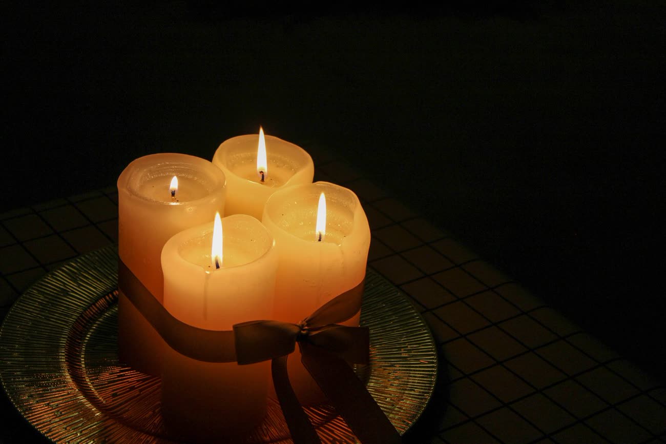 Candles and flowers at a memorial
